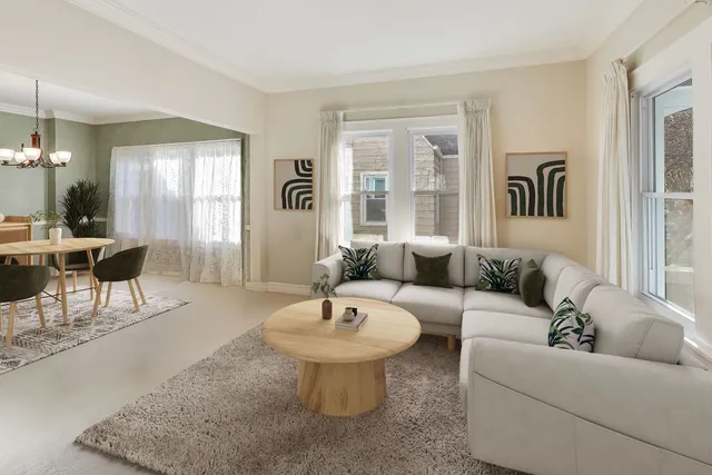 a dining room with wooden floor a chandelier a glass table and chairs