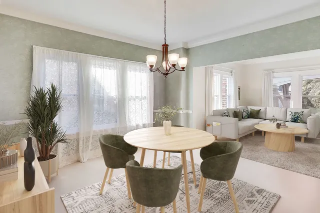 a view of a dining room with furniture and a chandelier