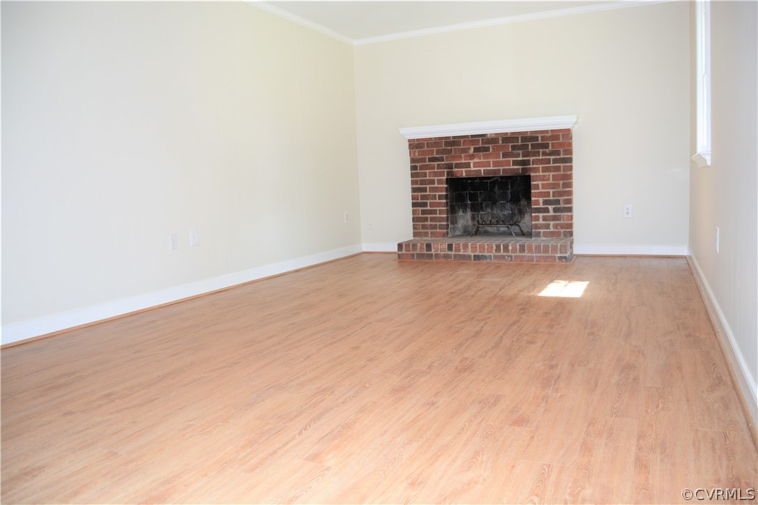 2018 Orangewood Road North Chesterfield, VA 23235 - Photo 13 of 26 a view of an empty room with wooden floor fireplace and a window