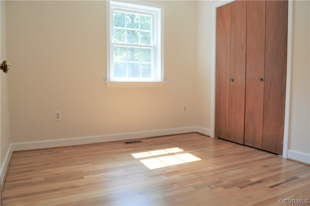 2018 Orangewood Road North Chesterfield, VA 23235 - Photo 16 of 26 an empty room with wooden floor and windows