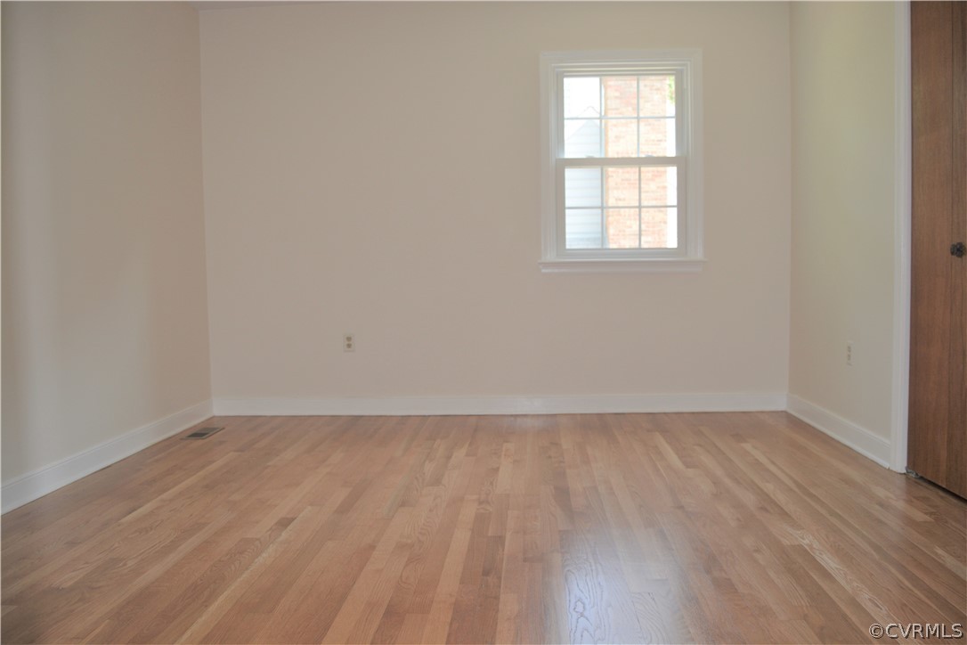 2018 Orangewood Road North Chesterfield, VA 23235 - Photo 19 of 26 an empty room with wooden floor and windows
