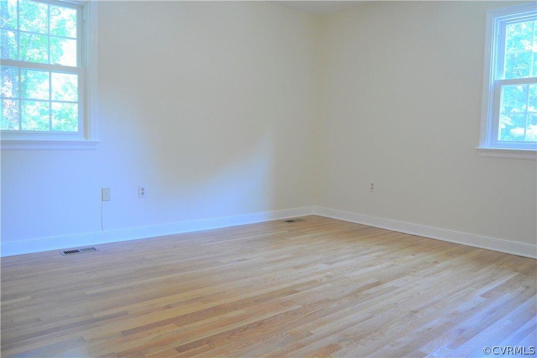 2018 Orangewood Road North Chesterfield, VA 23235 - Photo 20 of 26 an empty room with wooden floor and windows