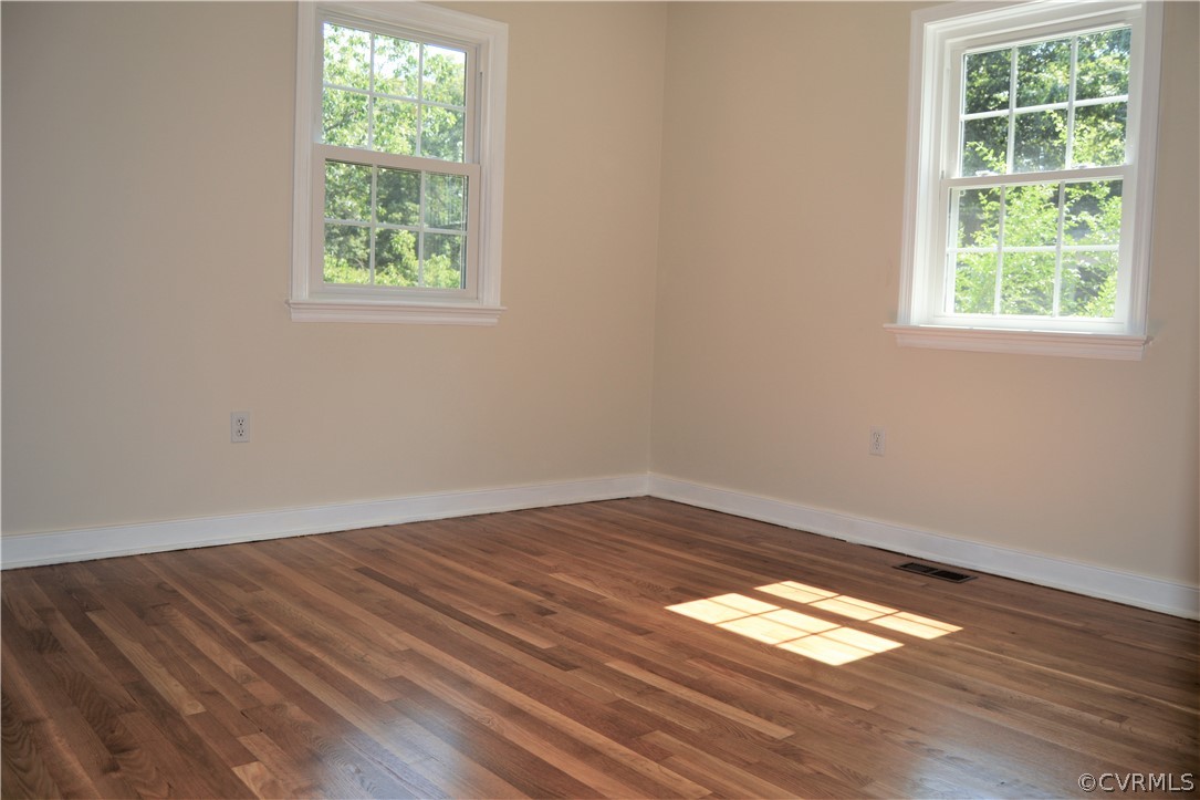 2018 Orangewood Road North Chesterfield, VA 23235 - Photo 21 of 26 an empty room with wooden floor and windows