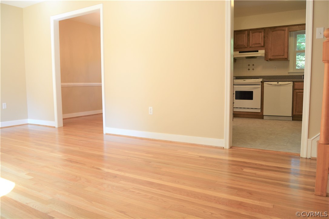 2018 Orangewood Road North Chesterfield, VA 23235 - Photo 3 of 26 a view of a kitchen with wooden floor and a refrigerator
