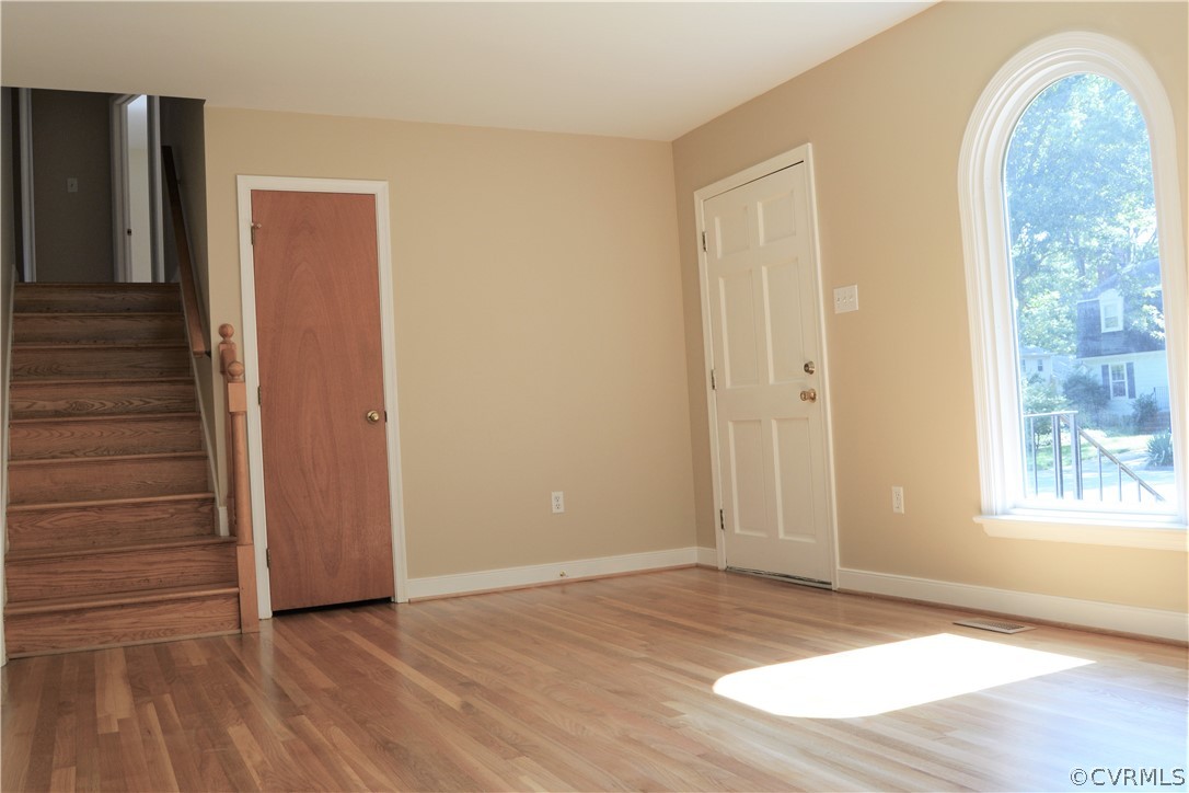 2018 Orangewood Road North Chesterfield, VA 23235 - Photo 4 of 26 a view of an empty room with wooden floor and a window