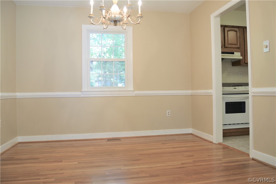 2018 Orangewood Road North Chesterfield, VA 23235 - Photo 8 of 26 wooden floor in an empty room with a window