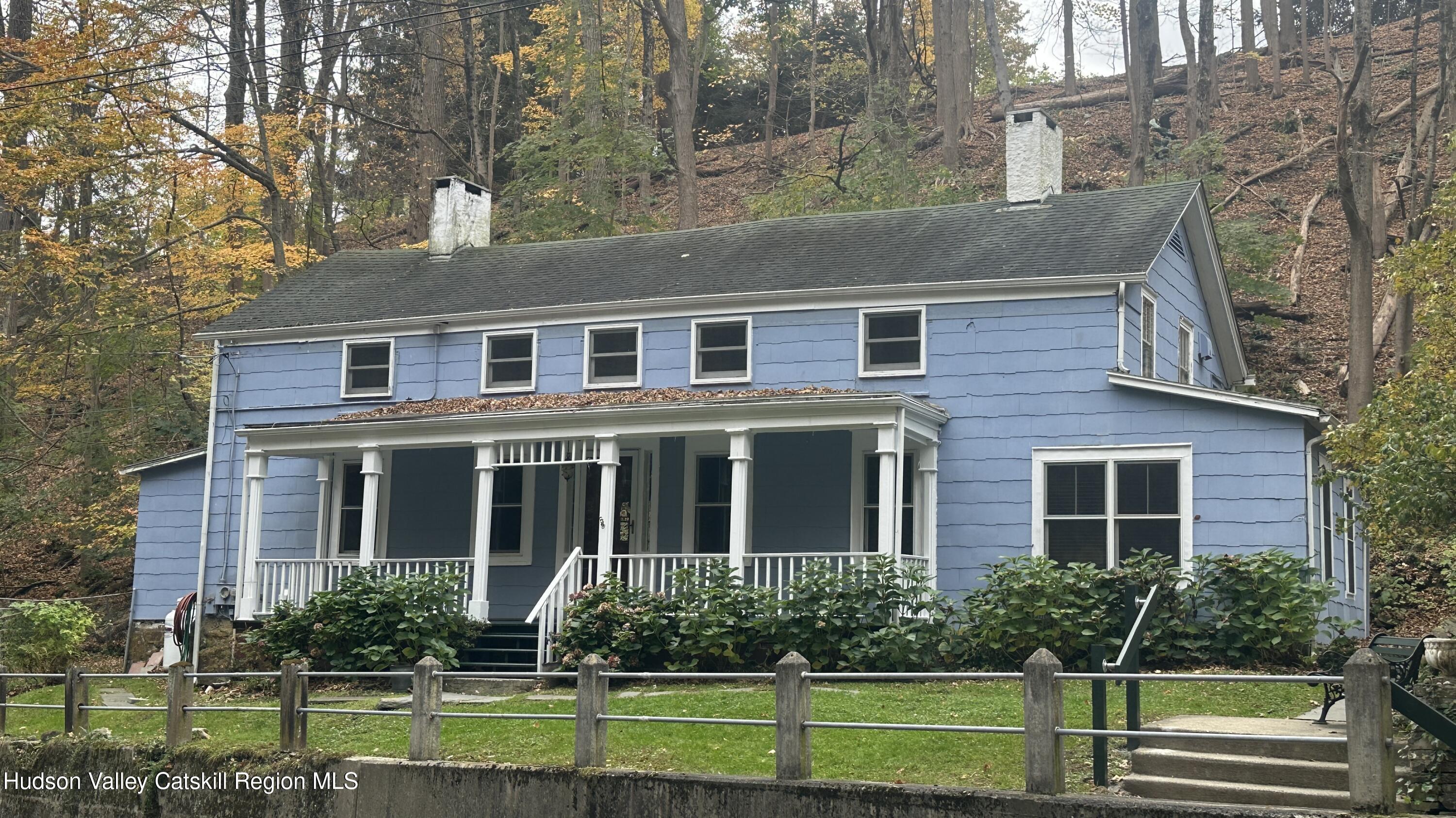 7 River Road, Unit TOWN ROAD Highland, NY 12528 - Photo 11 of 25 a front view of a house with a yard