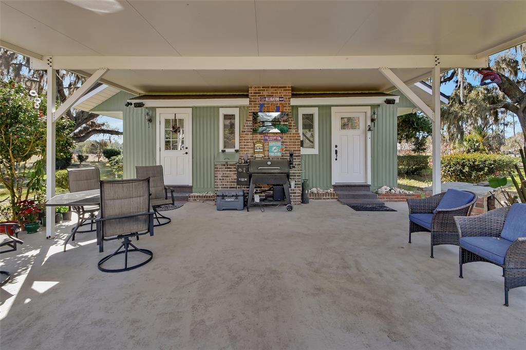 1403 Blackwelder Road De Leon Springs, FL 32130 - Photo 19 of 93 a view of a livingroom with furniture and a window