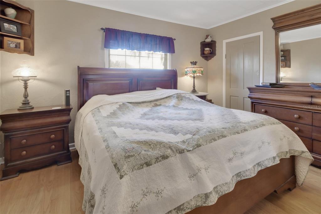 1403 Blackwelder Road De Leon Springs, FL 32130 - Photo 43 of 93 a bedroom with a bed and a dresser in it
