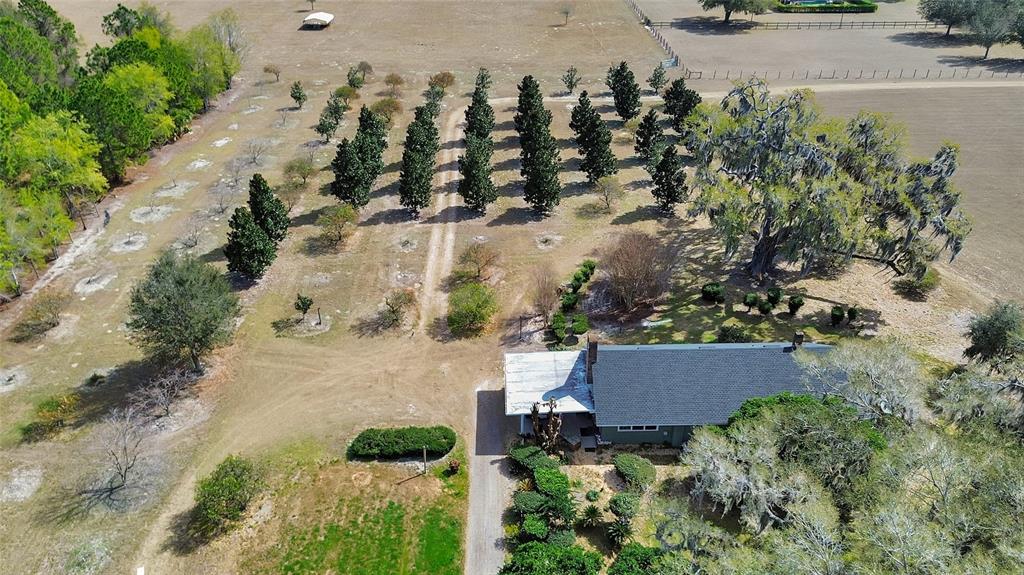 1403 Blackwelder Road De Leon Springs, FL 32130 - Photo 60 of 93 an aerial view of a house with a yard and lake view