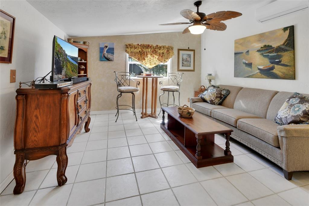 1403 Blackwelder Road De Leon Springs, FL 32130 - Photo 73 of 93 a living room with furniture and a flat screen tv