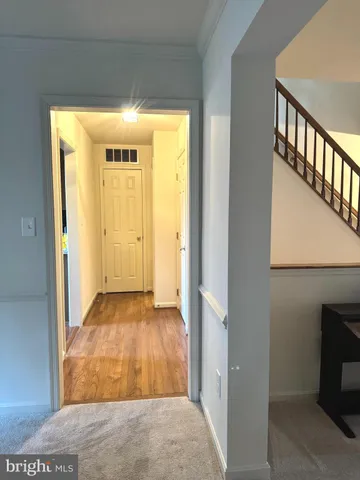 a view of entryway with wooden floor