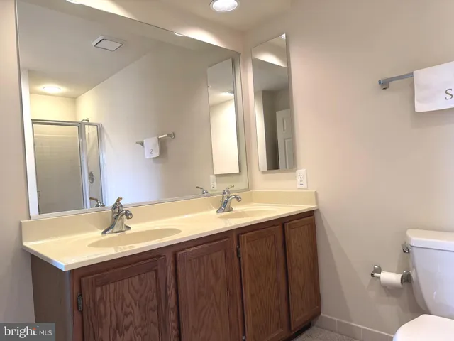 a bedroom with a bed and a chair