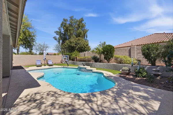 a view of a backyard of the house