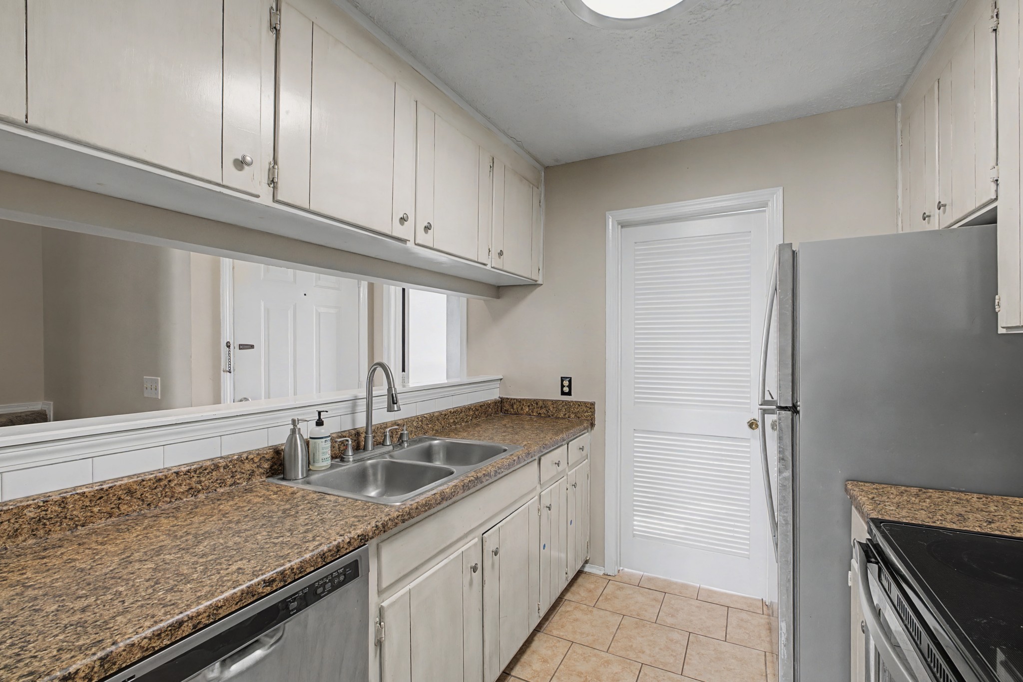 4316 Baton Rouge Drive Hermitage, TN 37076 - Photo 7 of 20 a kitchen with granite countertop a sink and a refrigerator