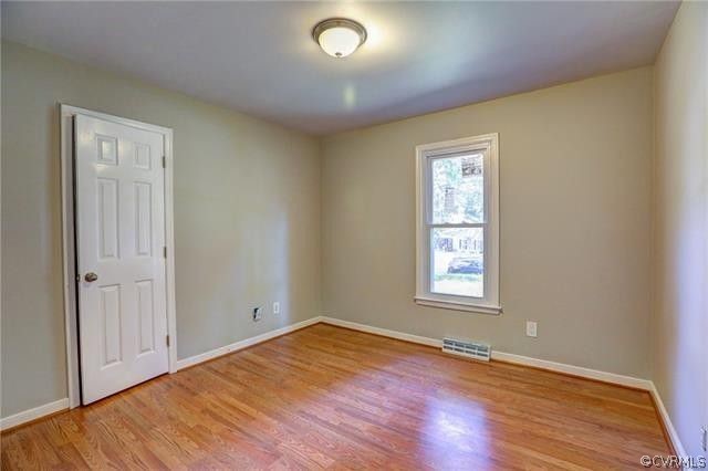 2506 Colgrave Road Midlothian, VA 23112 - Photo 11 of 21 an empty room with wooden floor and windows