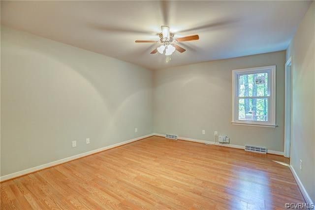 2506 Colgrave Road Midlothian, VA 23112 - Photo 13 of 21 an empty room with wooden floor fan and windows