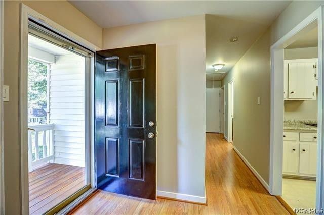 2506 Colgrave Road Midlothian, VA 23112 - Photo 2 of 21 a view of a hallway with wooden floor and living room