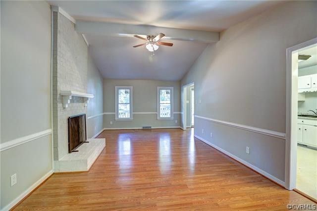 2506 Colgrave Road Midlothian, VA 23112 - Photo 3 of 21 a view of an empty room with wooden floor and a window