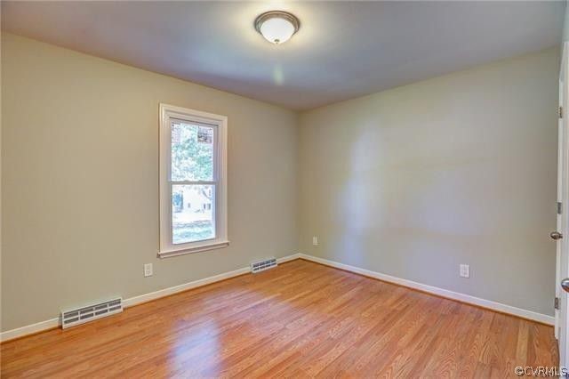 2506 Colgrave Road Midlothian, VA 23112 - Photo 10 of 21 an empty room with wooden floor and windows