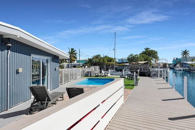 a view of a swimming pool with sitting area