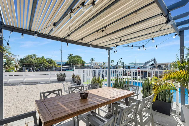 an aerial view of a house with outdoor space