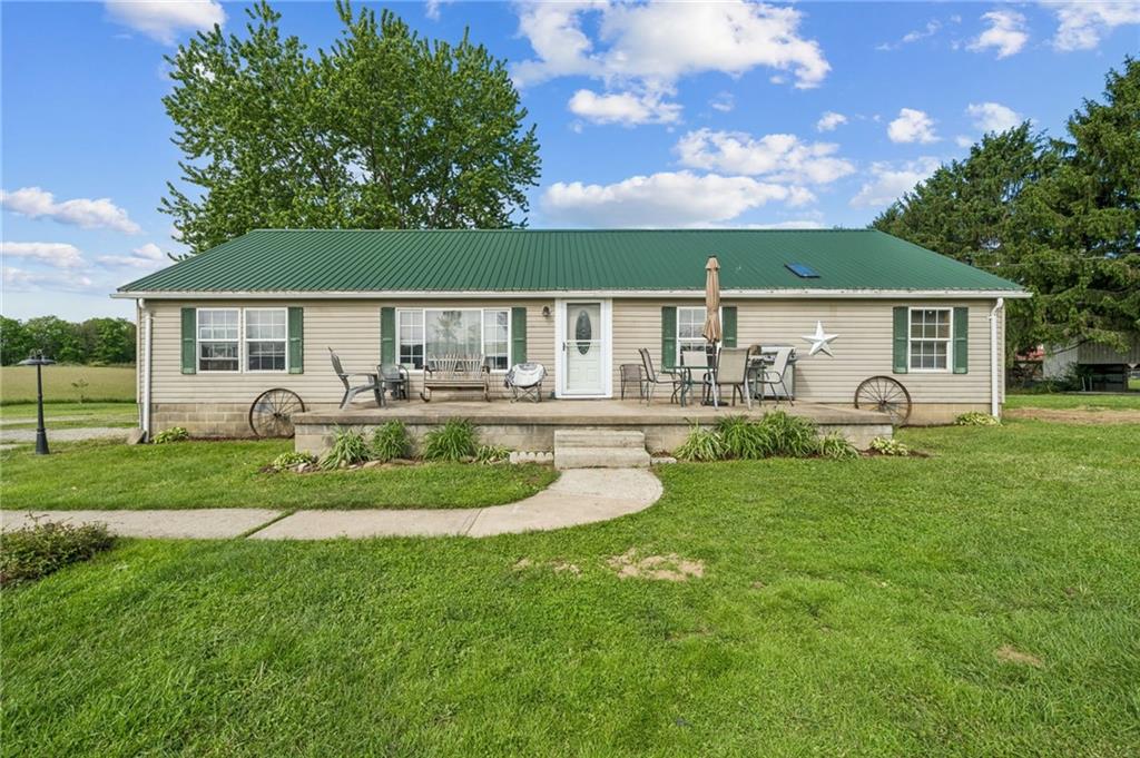 275 Adamik Road Clarksville, PA 15322 - Photo 31 of 39 a front view of house with a garden and patio
