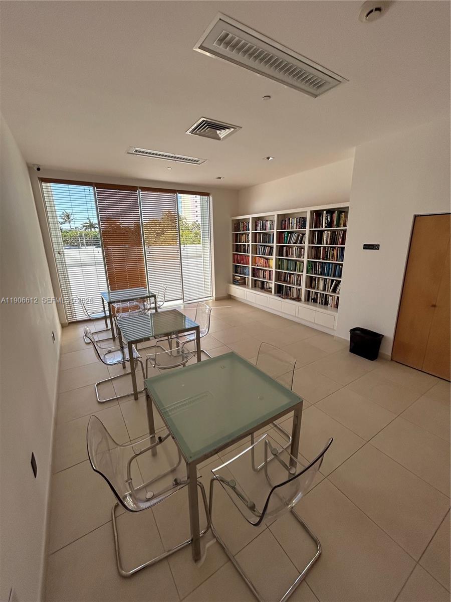 881 Ocean Drive, Unit 26B Key Biscayne, FL 33149 - Photo 33 of 34 a view of a dining room with furniture and windows