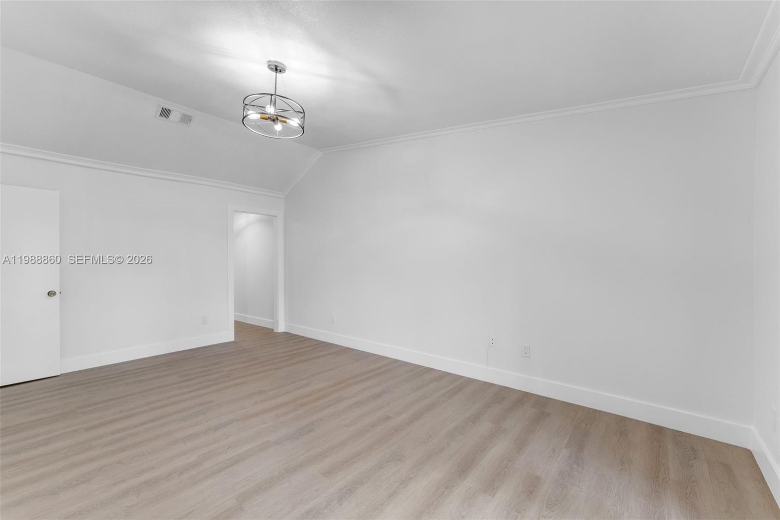 10021 Southwest 145th Place Miami, FL 33186 - Photo 13 of 44 wooden floor in an empty room