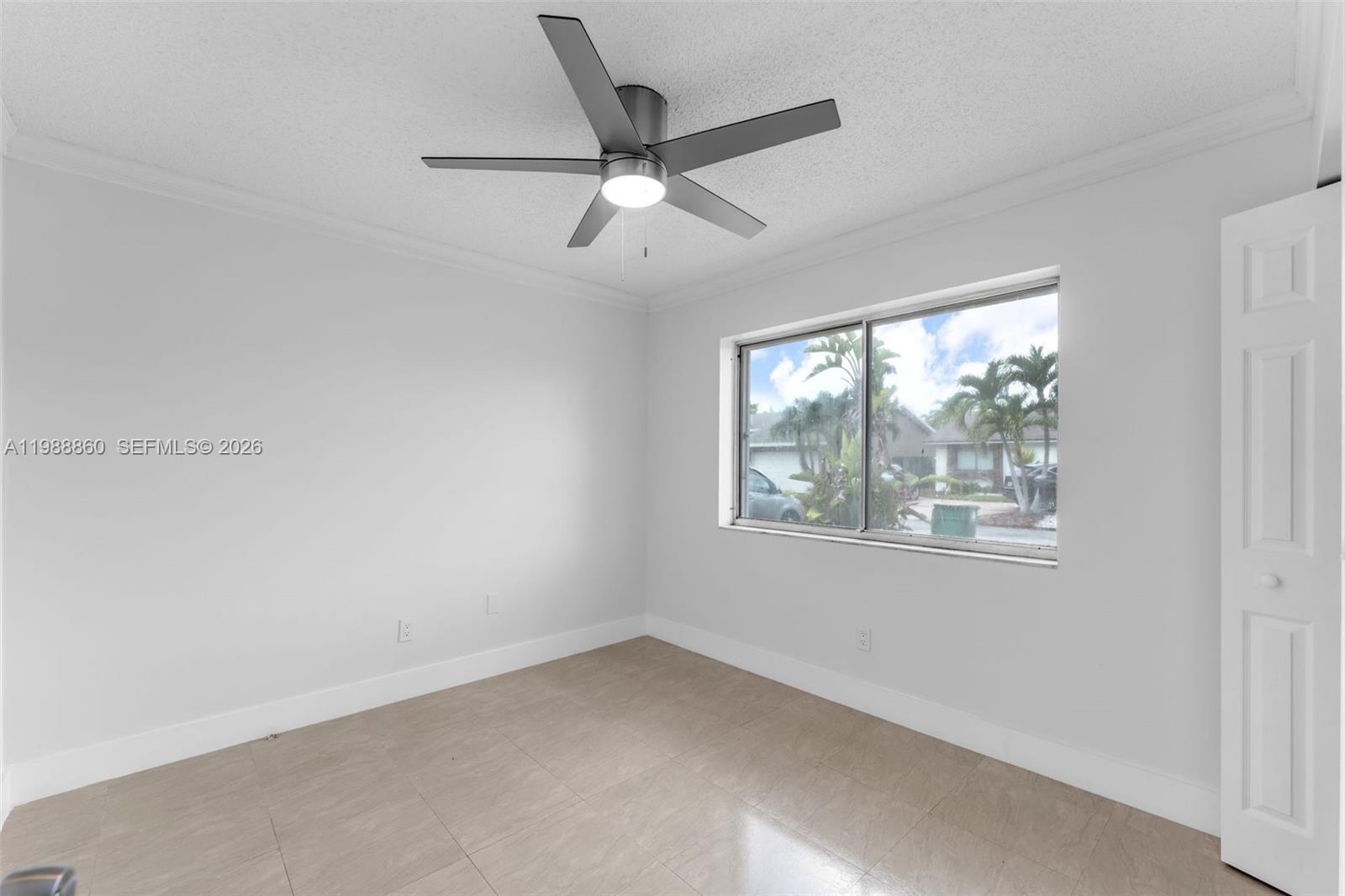 10021 Southwest 145th Place Miami, FL 33186 - Photo 20 of 44 an empty room with a window