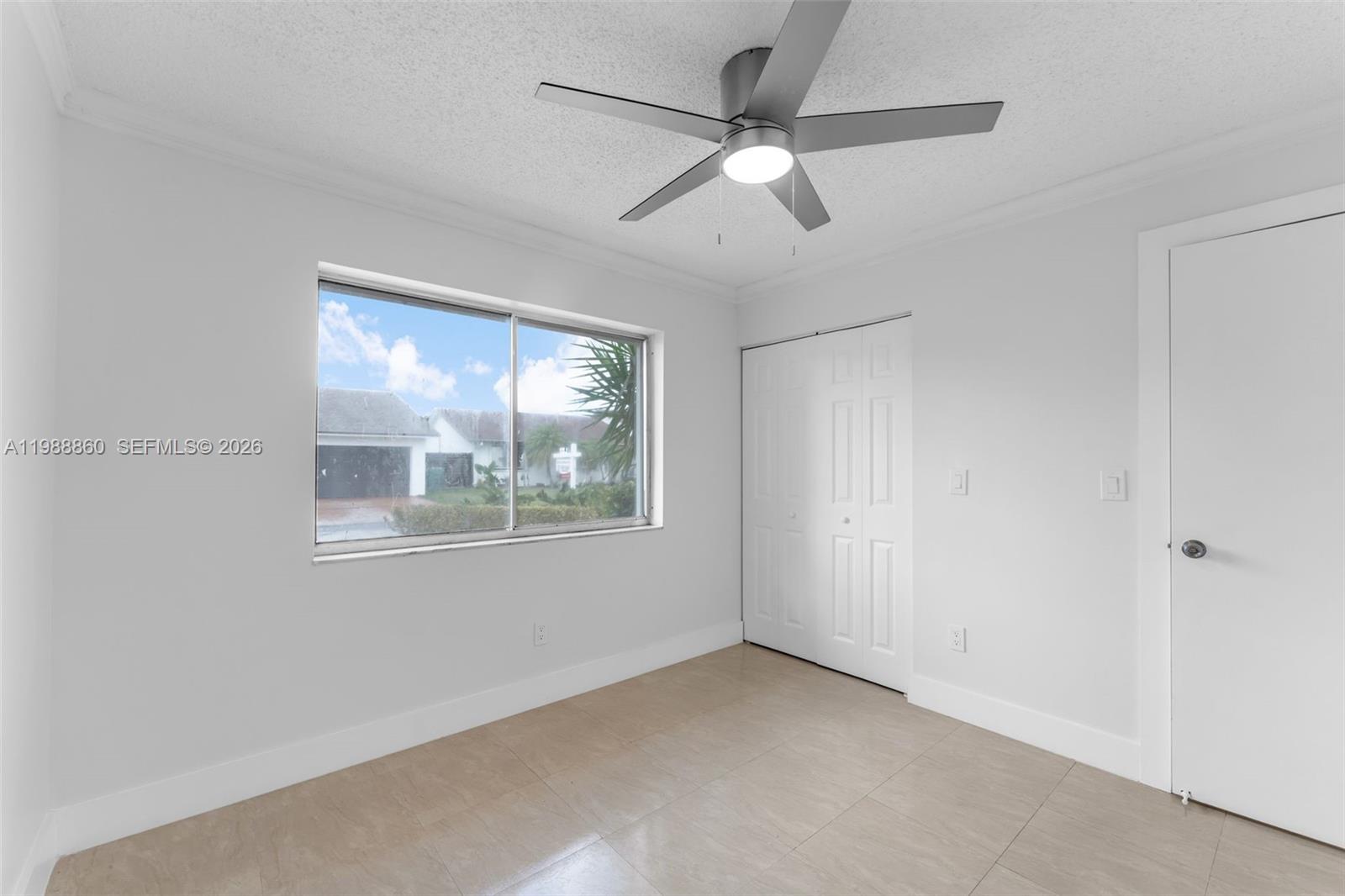 10021 Southwest 145th Place Miami, FL 33186 - Photo 21 of 44 an empty room with window