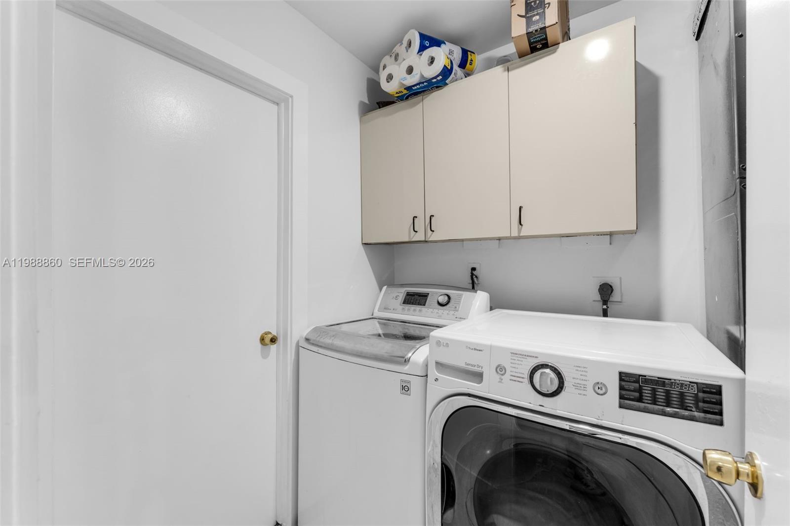 10021 Southwest 145th Place Miami, FL 33186 - Photo 25 of 44 a utility room with dryer and washer