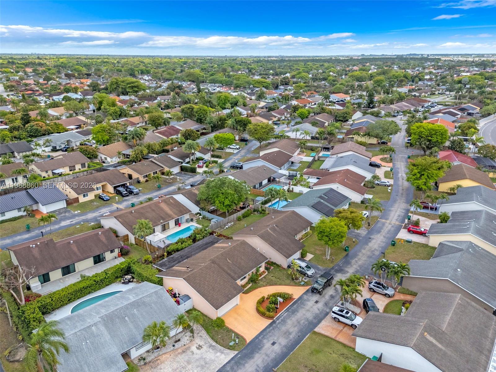 10021 Southwest 145th Place Miami, FL 33186 - Photo 34 of 44 an aerial view of residential houses with outdoor space
