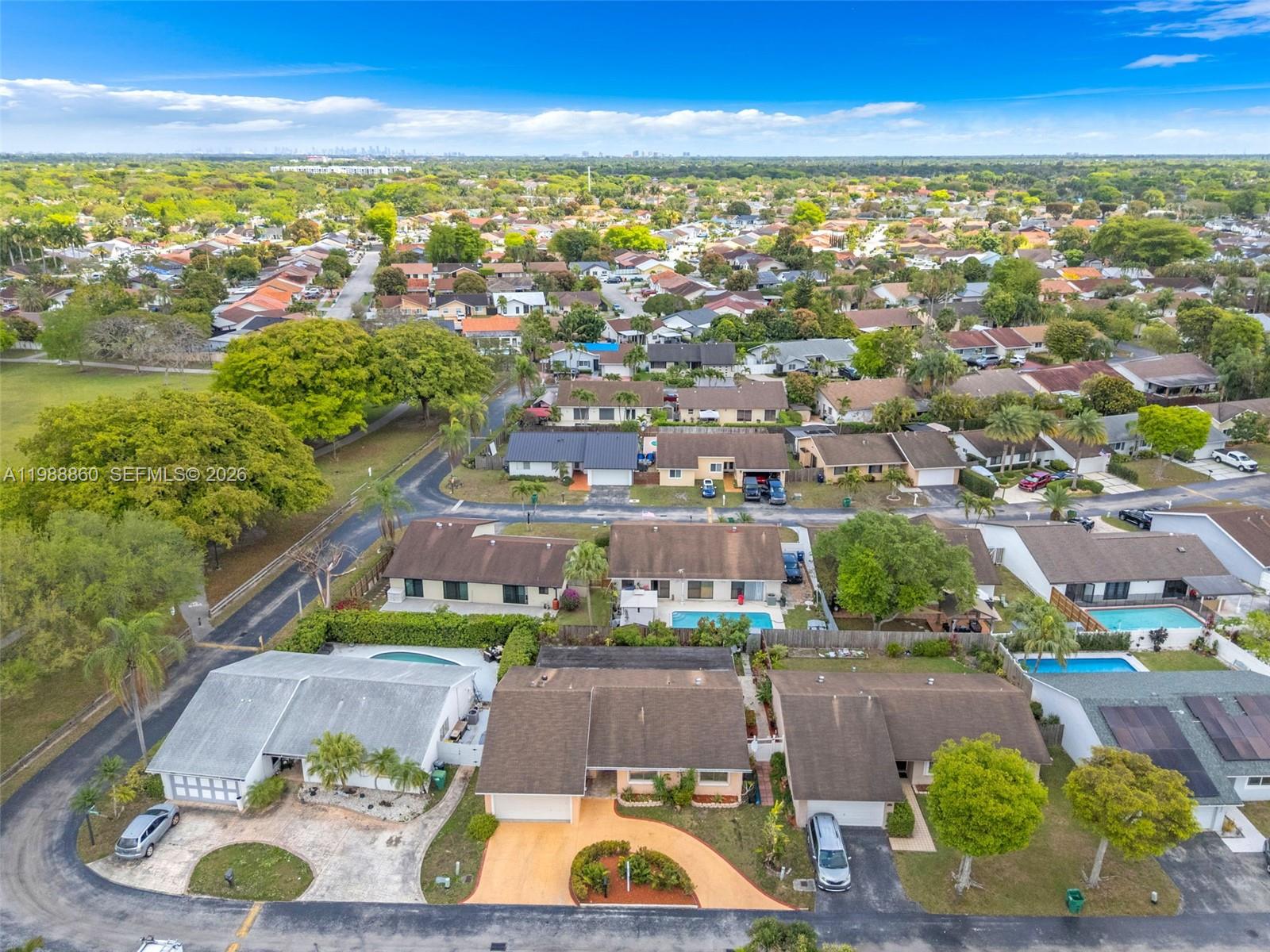 10021 Southwest 145th Place Miami, FL 33186 - Photo 42 of 44 an aerial view of residential houses with outdoor space and swimming pool