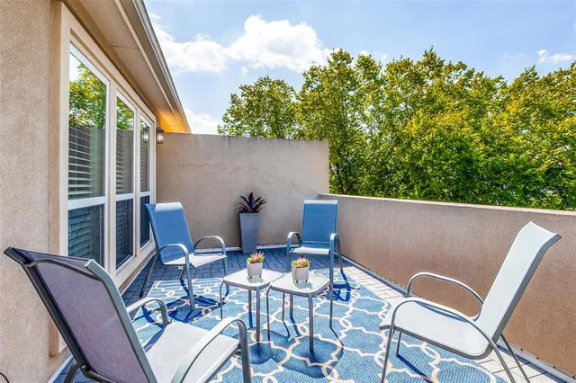 a view of a patio with furniture