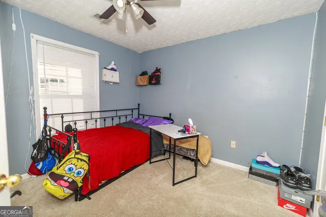 a kids room with toys and a chandelier