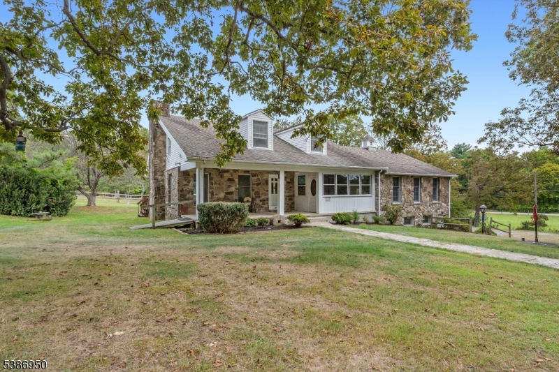 87 Glen Road Wantage, NJ 07461 - Photo 3 of 40 a front view of a house with a yard