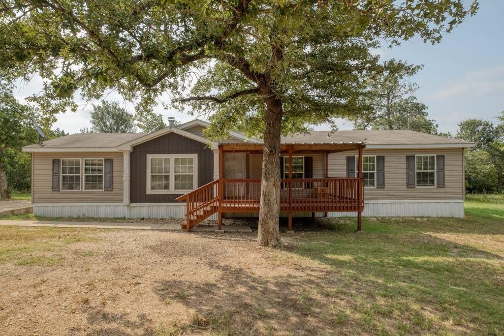 front view of a house with a yard