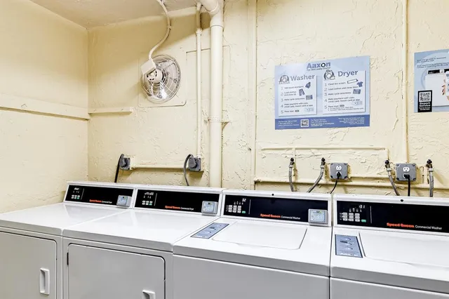 a room with a sink and cabinets