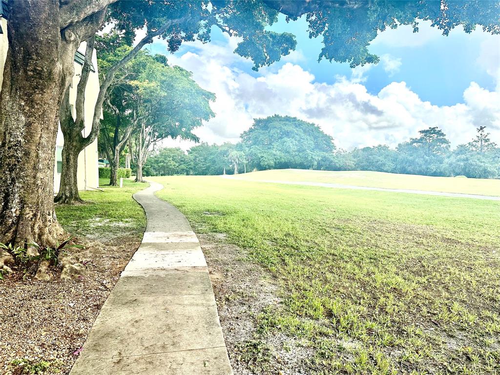 9080 Lime Bay Boulevard, Unit 109 Tamarac, FL 33321 - Photo 20 of 49 a view of big yard with an outdoor space