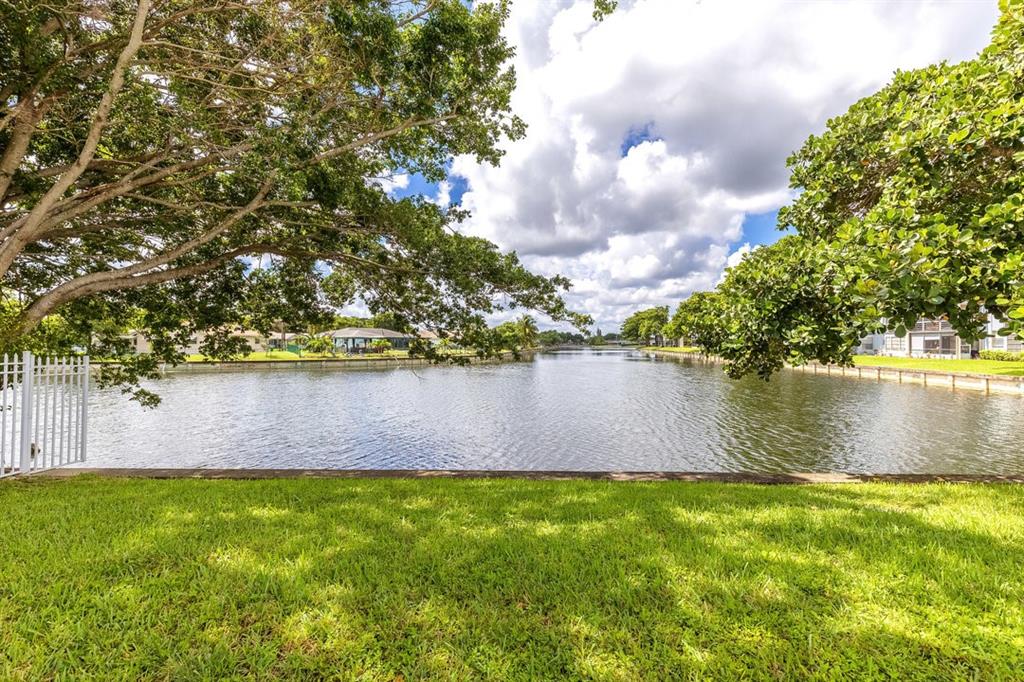9080 Lime Bay Boulevard, Unit 109 Tamarac, FL 33321 - Photo 21 of 49 a view of lake from a yard