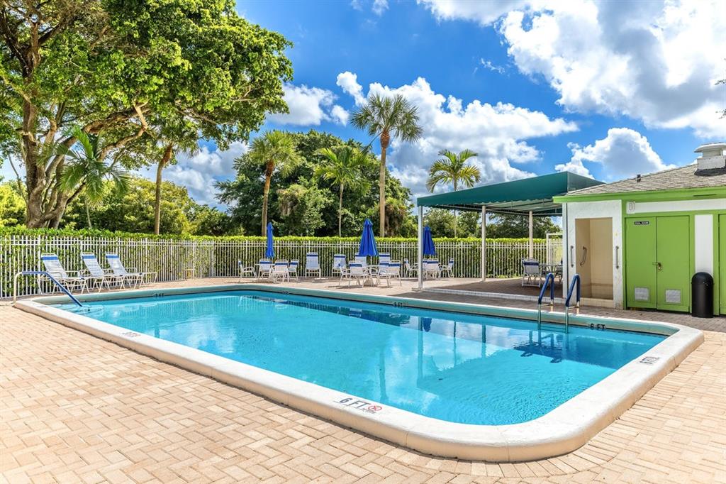 9080 Lime Bay Boulevard, Unit 109 Tamarac, FL 33321 - Photo 23 of 49 a view of a swimming pool with outdoor seating