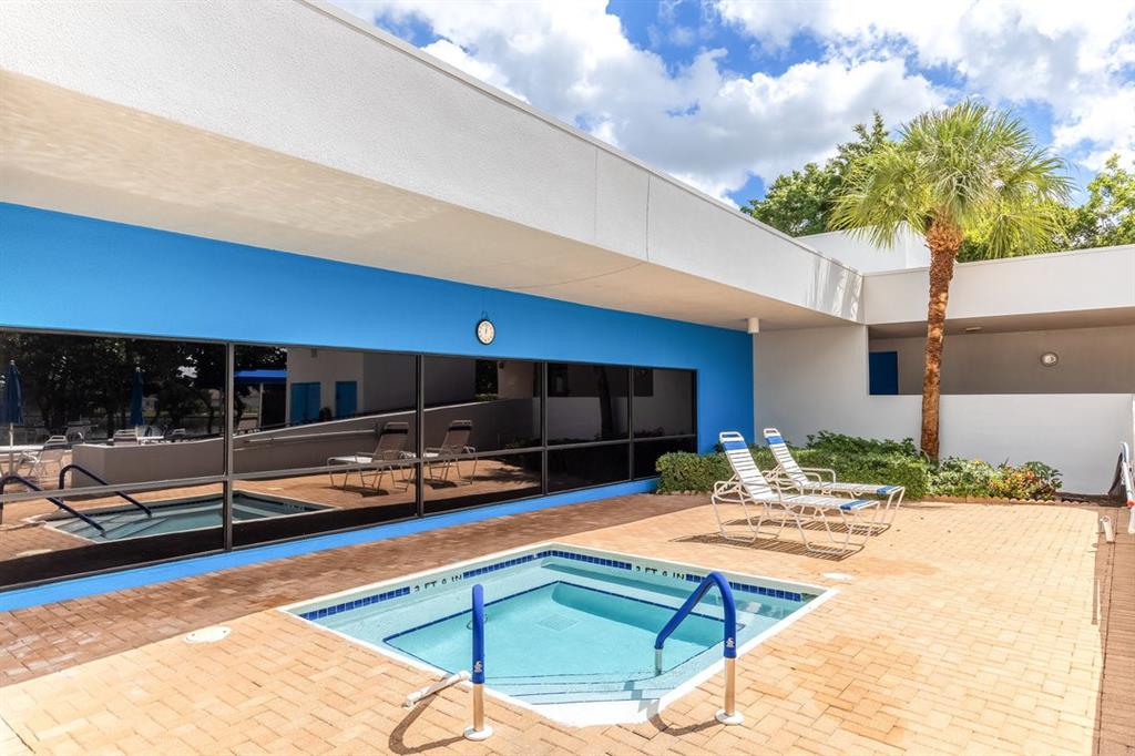 9080 Lime Bay Boulevard, Unit 109 Tamarac, FL 33321 - Photo 24 of 49 a outdoor space with swimming pool and furniture
