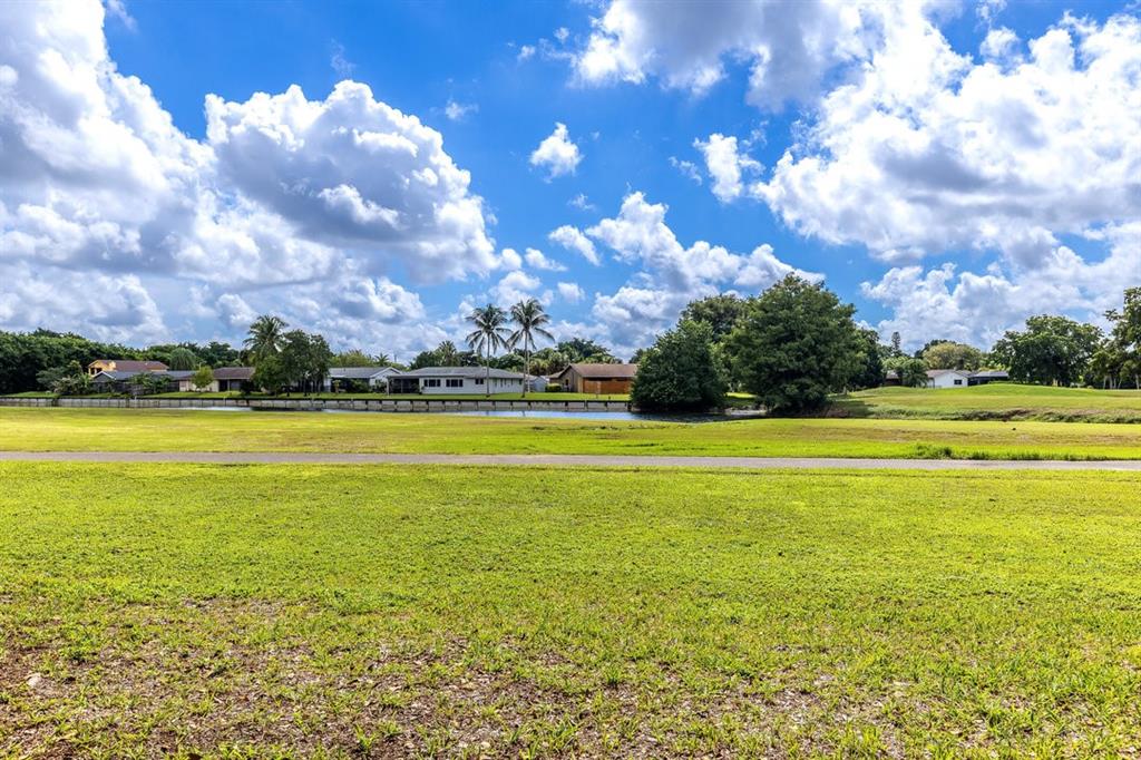 9080 Lime Bay Boulevard, Unit 109 Tamarac, FL 33321 - Photo 25 of 49 a view of an ocean and beach