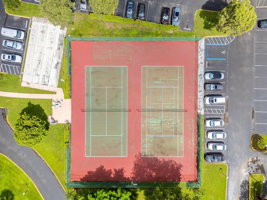 9080 Lime Bay Boulevard, Unit 109 Tamarac, FL 33321 - Photo 28 of 49 a front view of a house with a yard