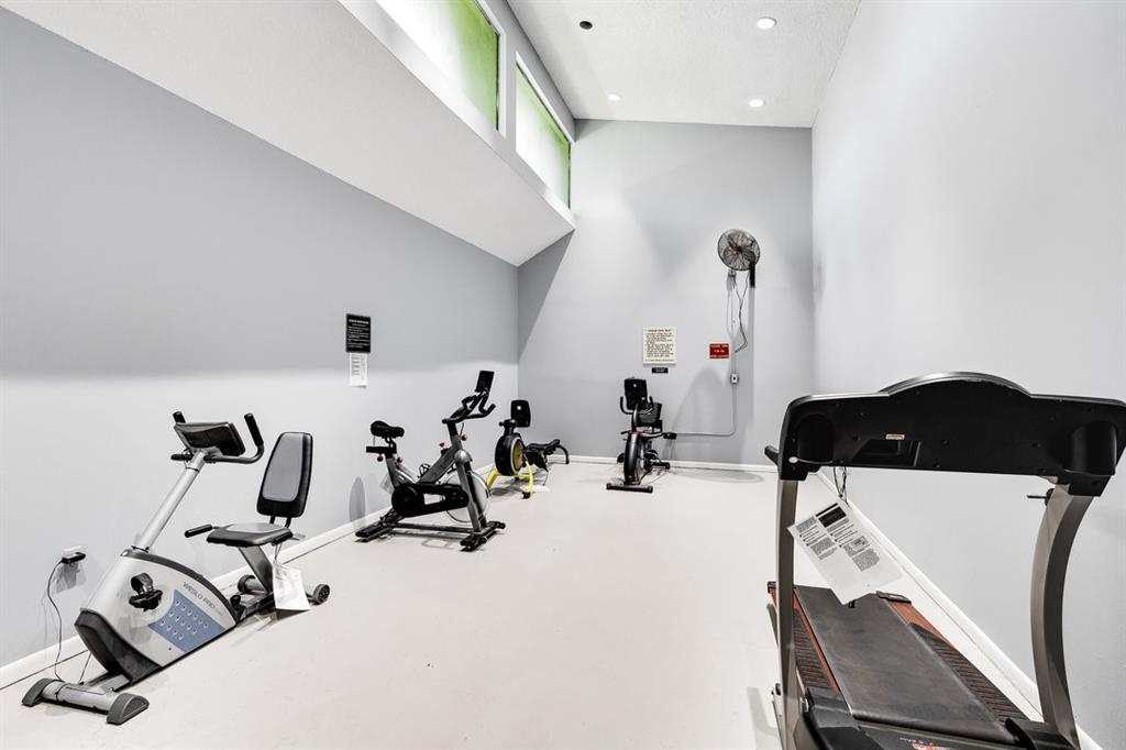 9080 Lime Bay Boulevard, Unit 109 Tamarac, FL 33321 - Photo 31 of 49 a room with gym equipment and view of living room
