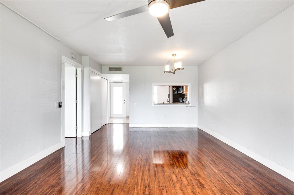 9080 Lime Bay Boulevard, Unit 109 Tamarac, FL 33321 - Photo 38 of 49 wooden floor in an empty room with a window