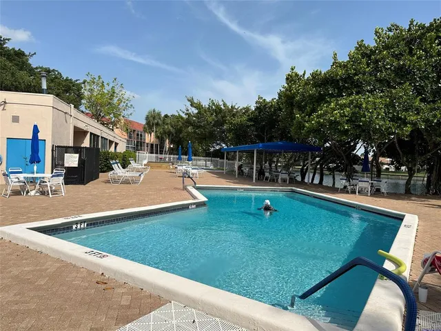 a view of a swimming pool with a patio