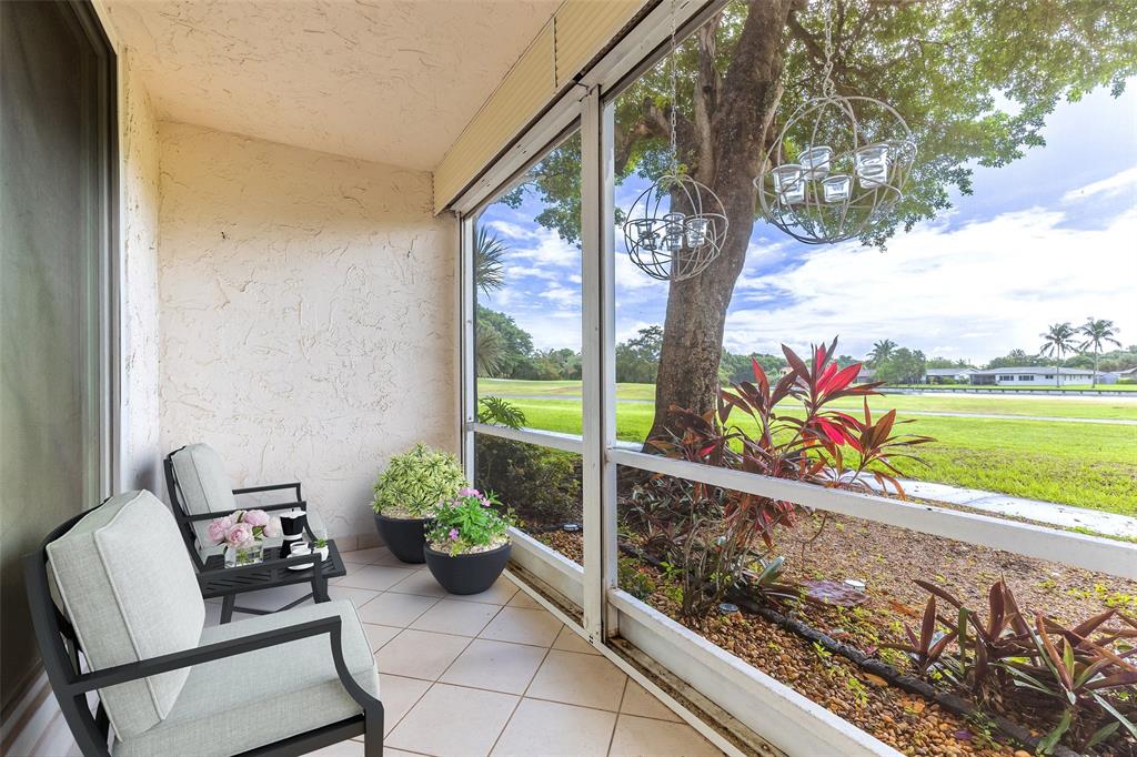 9080 Lime Bay Boulevard, Unit 109 Tamarac, FL 33321 - Photo 7 of 49 a view of a bench in balcony