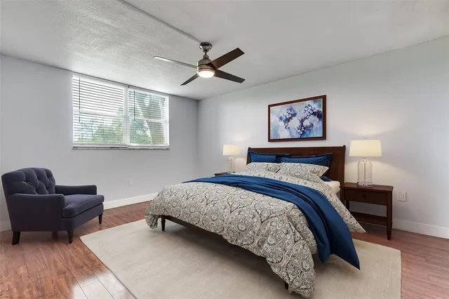 a bedroom with a bed and a couch